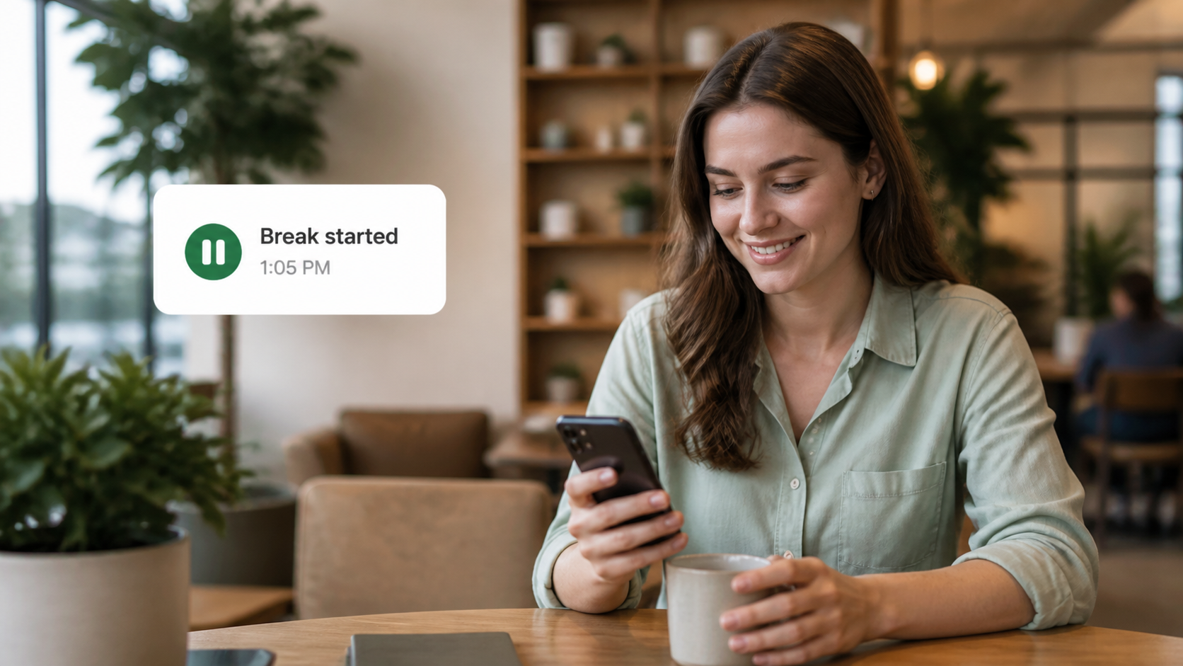 An employee beginning a break in a bright café with a break timer card.